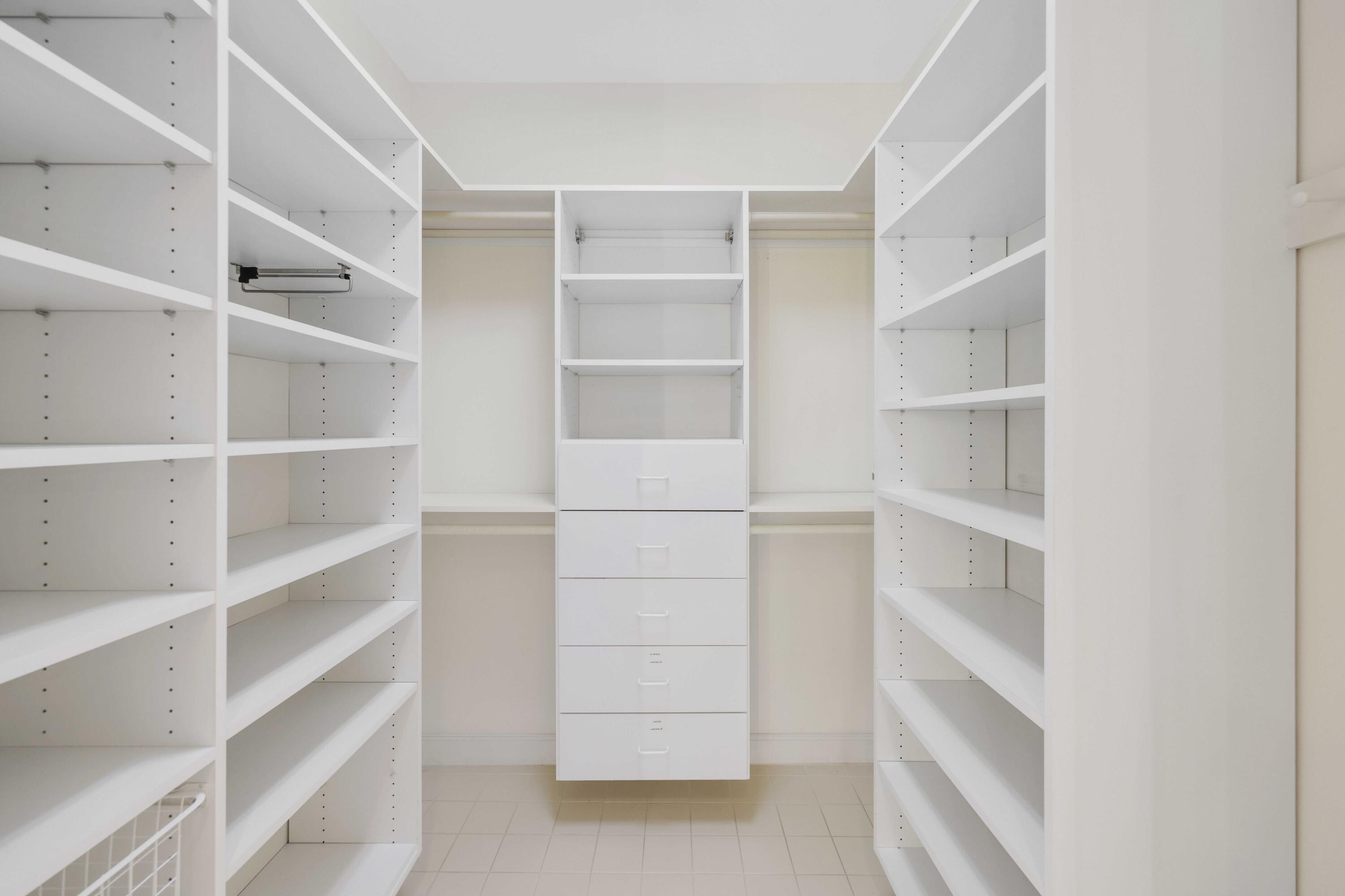 5 Country Road East, Unit A Boynton Beach, FL 33436 - Photo 31 of 51 a view of walk in closet with empty racks