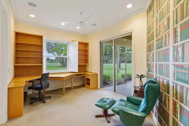 a view of a livingroom with furniture and a large window