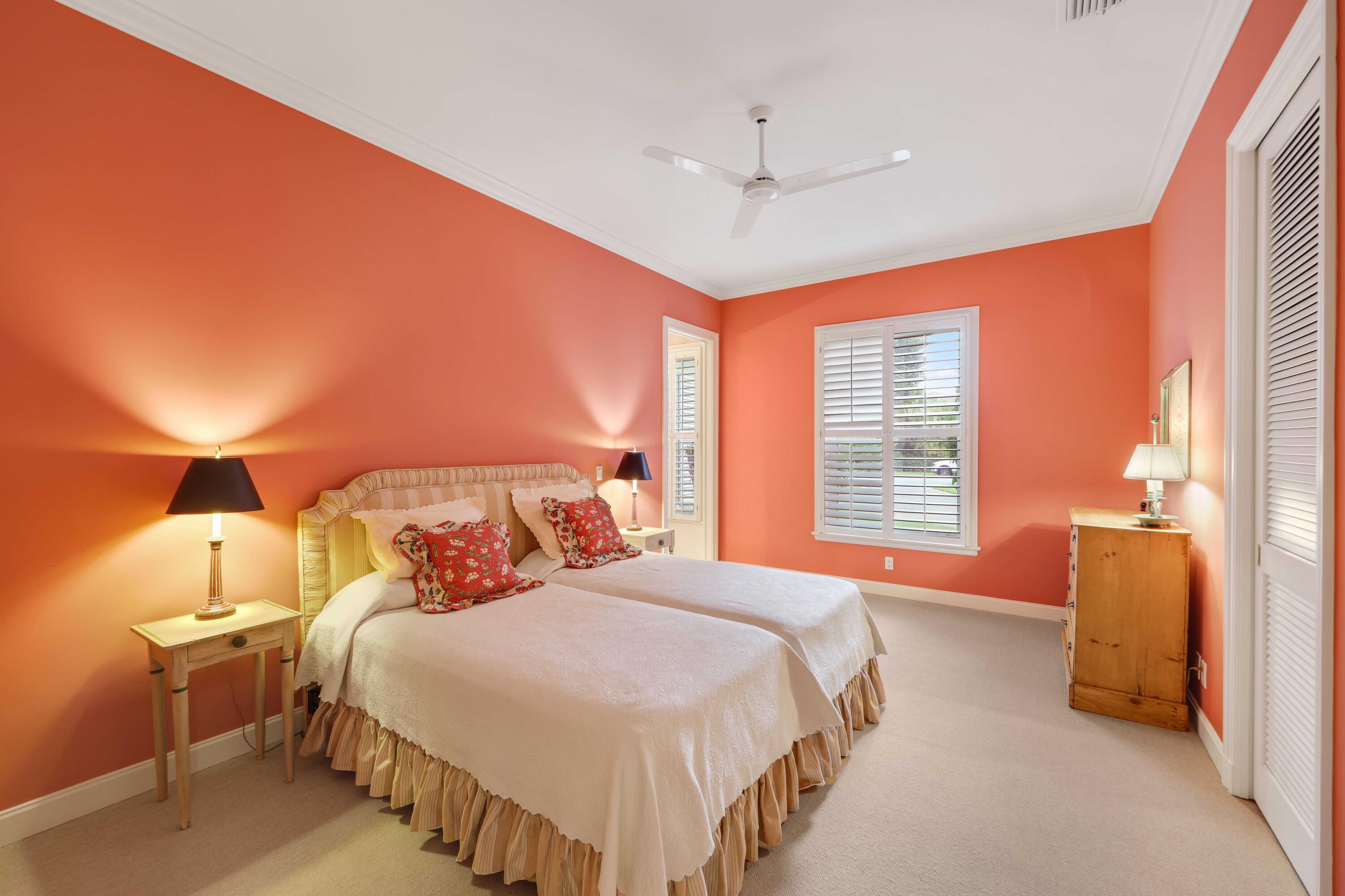 5 Country Road East, Unit A Boynton Beach, FL 33436 - Photo 38 of 51 a bedroom with a bed and a lamp