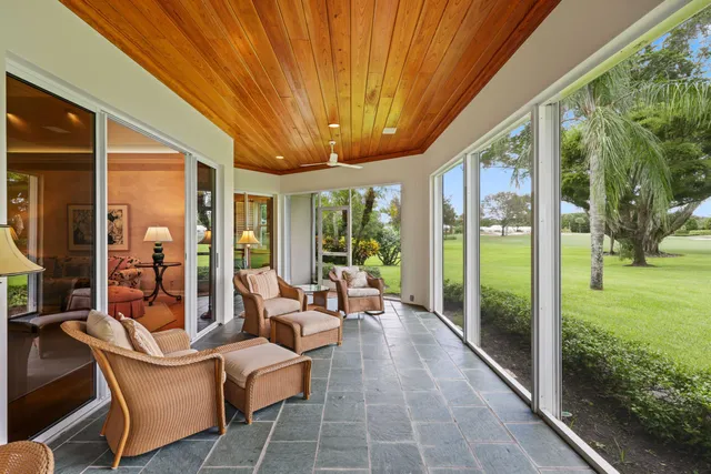 a balcony with furniture and garden view