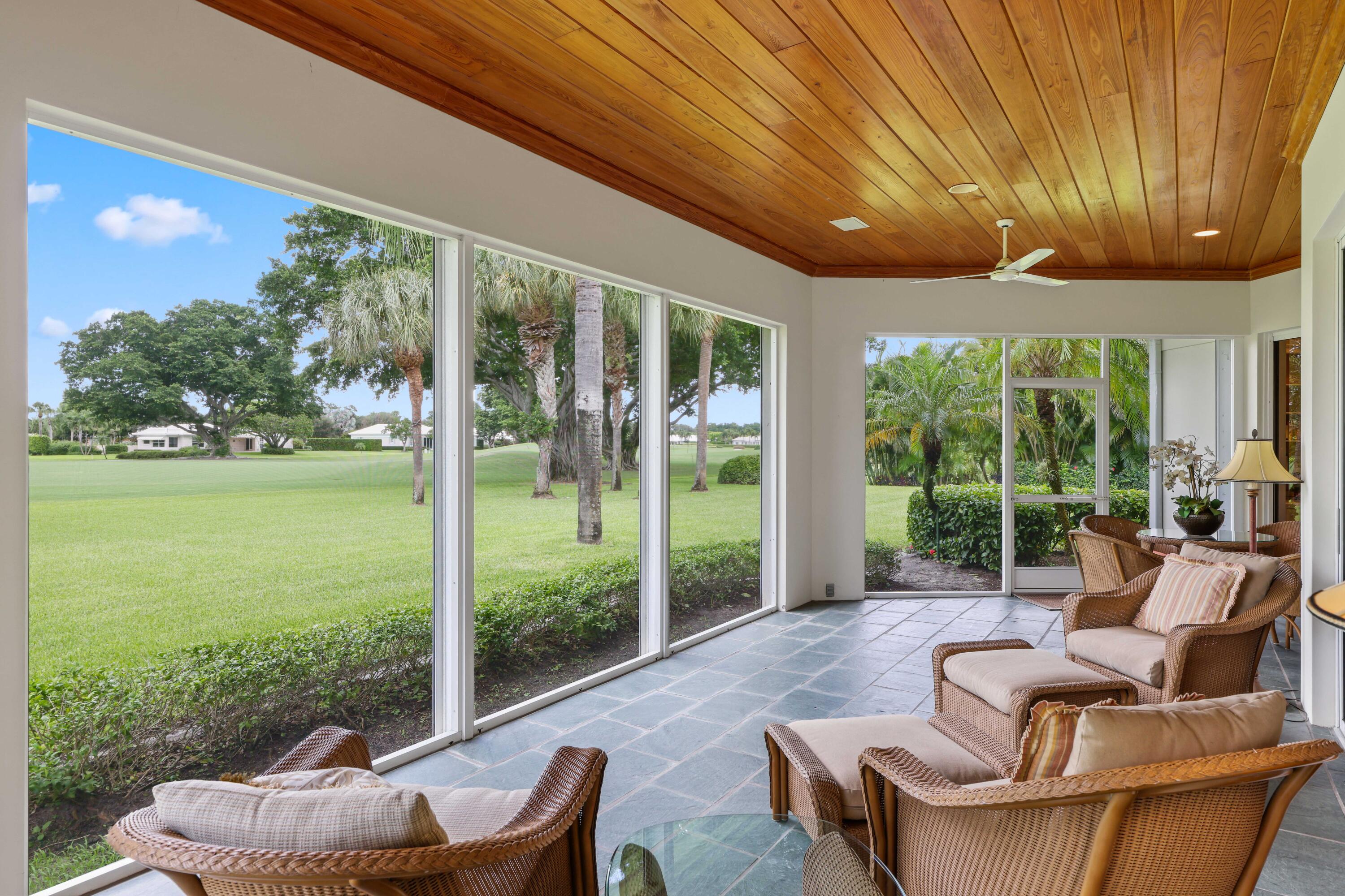 5 Country Road East, Unit A Boynton Beach, FL 33436 - Photo 47 of 51 a balcony with furniture and garden view