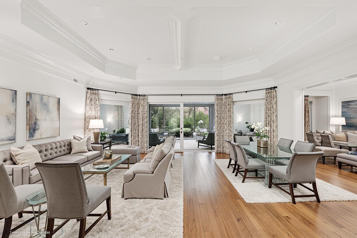 5 Country Road East, Unit A Boynton Beach, FL 33436 - Photo 8 of 51 a living room with furniture large windows and wooden floor