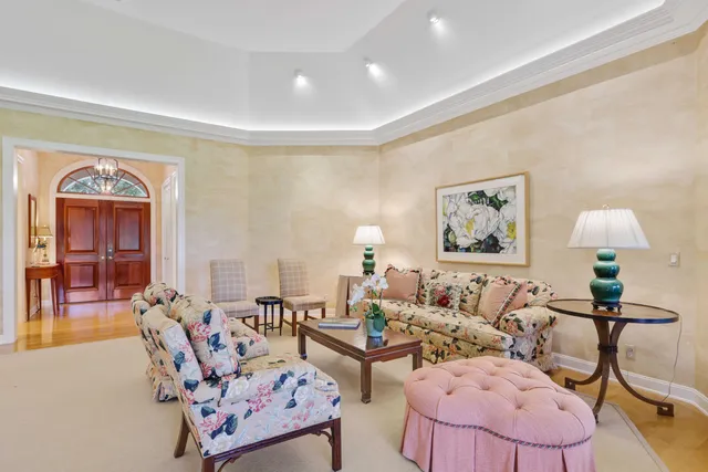 a living room with furniture or couch and a lamp