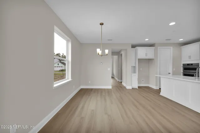 a view of a kitchen with a sink and a window