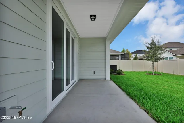a view of a porch with a garden