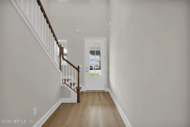 a view of entryway with wooden floor