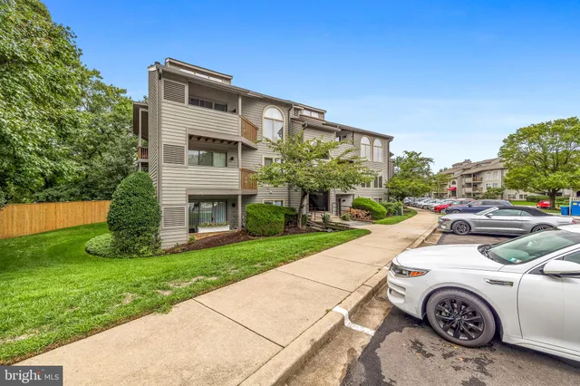 a view of water with boats and trees in the background