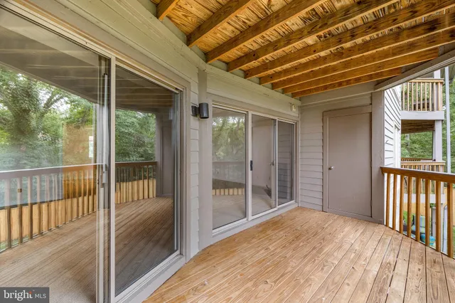a view of balcony with wooden floor