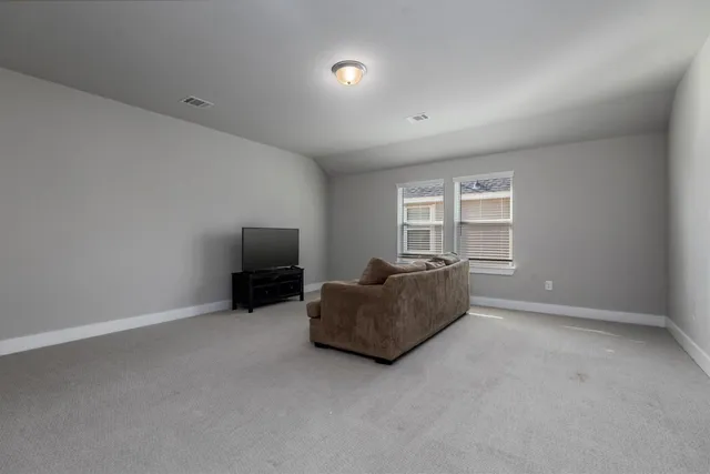 a living room with furniture and window