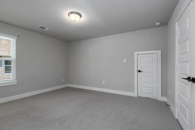 an empty room with a bench