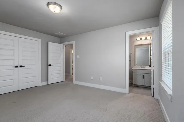 a bathroom with a sink toilet vanity and tub