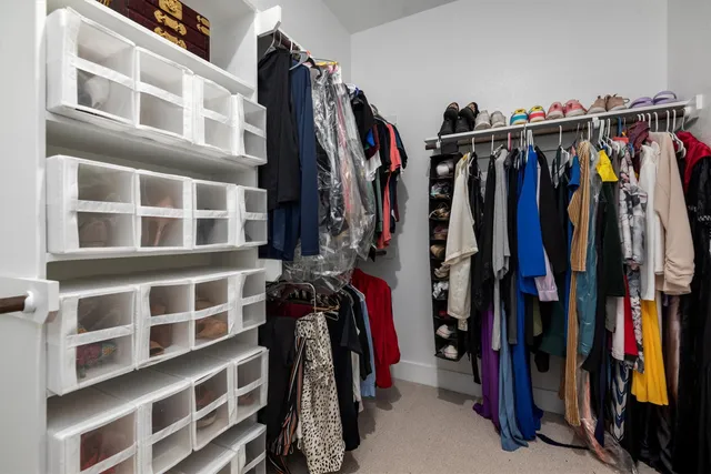 a view of a porch with a big yard and large tree