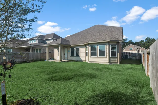 a view of a back yard of the house