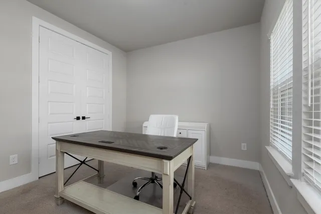 a workspace with furniture and window