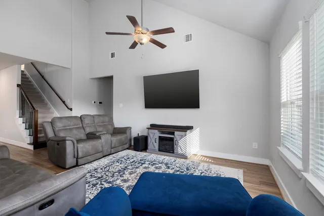 a bedroom with furniture and a flat screen tv