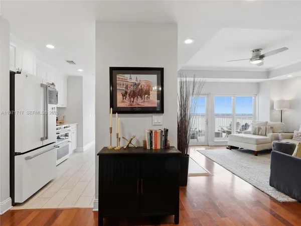 a spacious bathroom with a granite countertop sink and a mirror