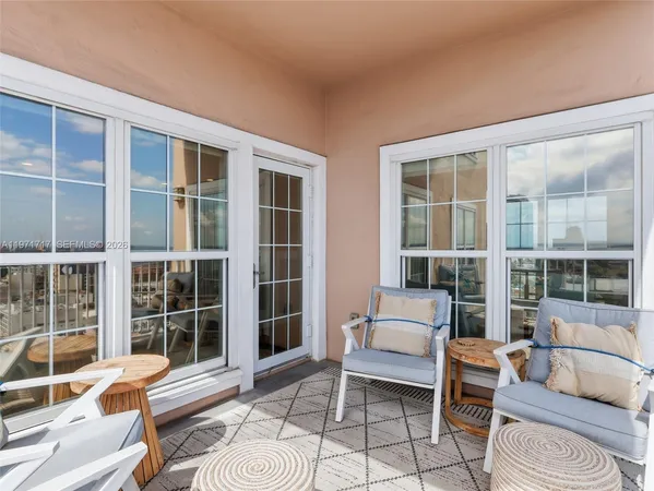 a bedroom with a large bed and a large window