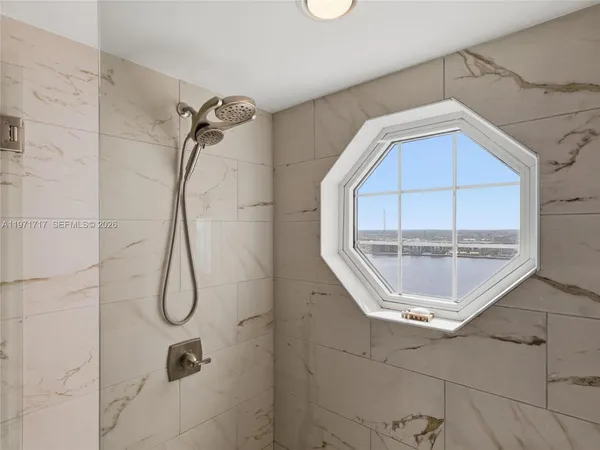a view of a balcony with two chairs and a table