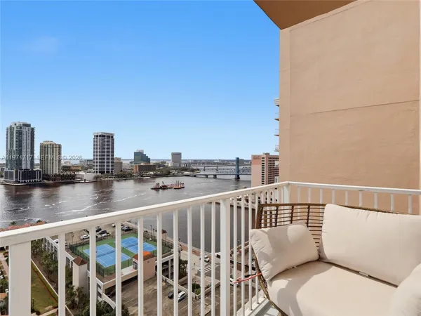 a bedroom with a bed and a table in it