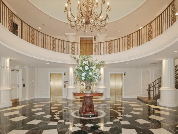 a living room with furniture a table and a painting