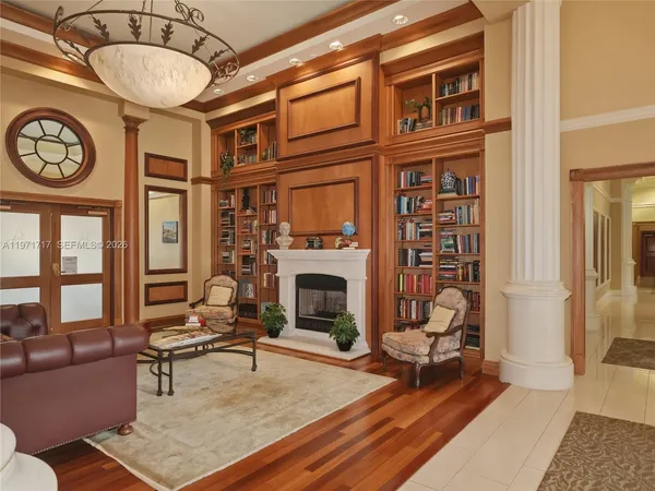 a view of swimming pool with outdoor seating and house in the background