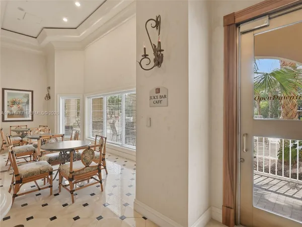 a open kitchen with stove and white cabinets
