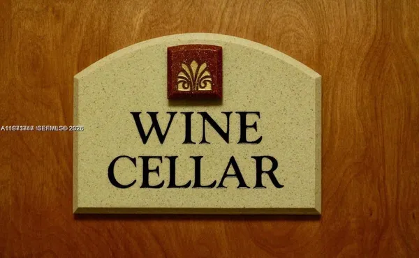 a picture of a bench in front of a gate