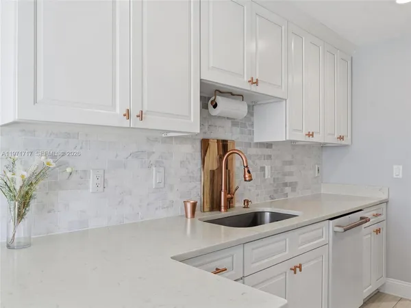 a kitchen with microwave cabinets and stove top oven