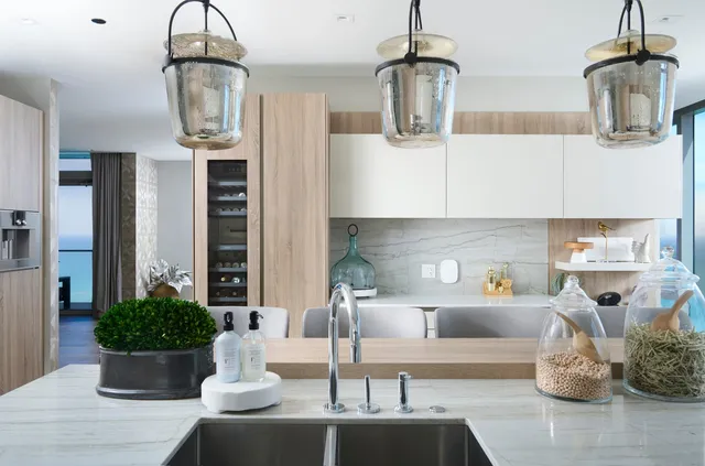 a kitchen with a table and chairs
