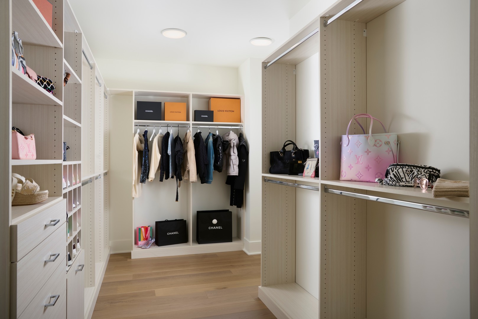 363 East Wacker Drive, Unit 6106 Chicago, IL 60601 - Photo 23 of 48 a view of walk in closet with clothes and shoes