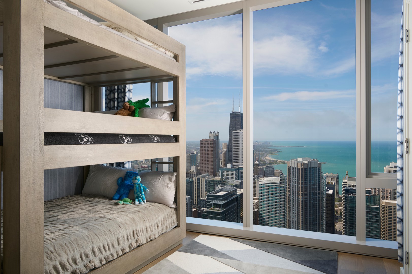 363 East Wacker Drive, Unit 6106 Chicago, IL 60601 - Photo 27 of 48 a bedroom with a bed a mirror and balcony view