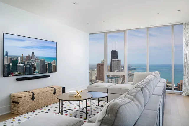 a living room with furniture and large window