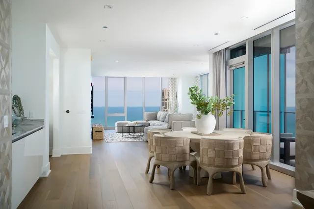 a view of a dining room with furniture and window