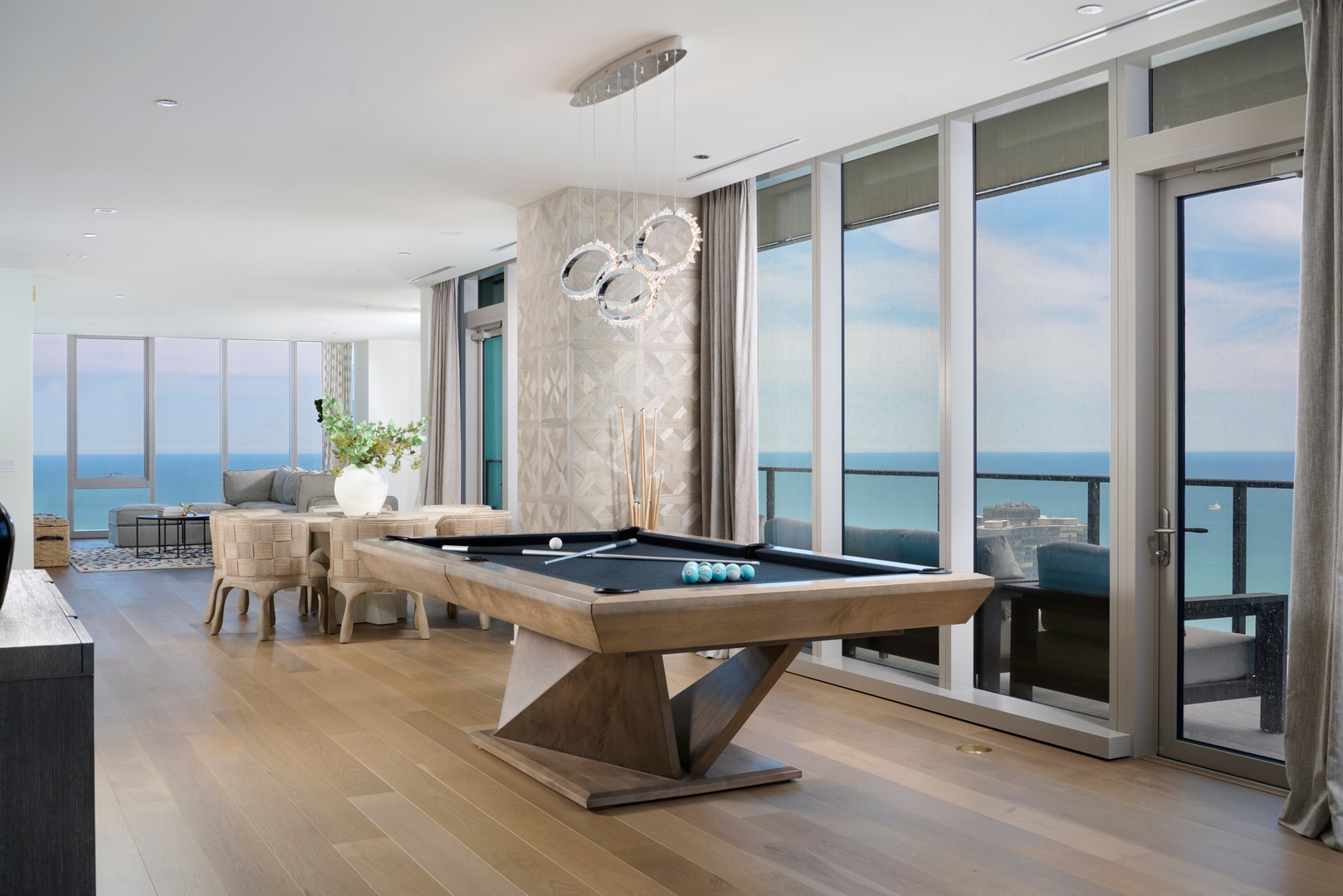 363 East Wacker Drive, Unit 6106 Chicago, IL 60601 - Photo 10 of 48 a room with furniture pool table and windows