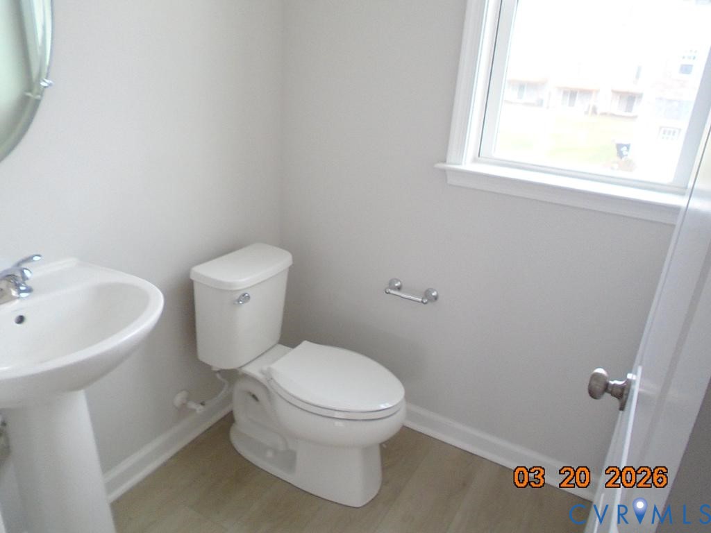 645 Rivanna Hill Road Glen Allen, VA 23060 - Photo 11 of 25 Half bath with toilet and light wood-style floors