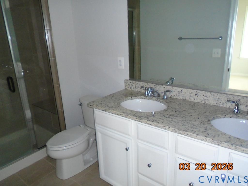 645 Rivanna Hill Road Glen Allen, VA 23060 - Photo 14 of 25 Full bathroom featuring double vanity, a stall sho