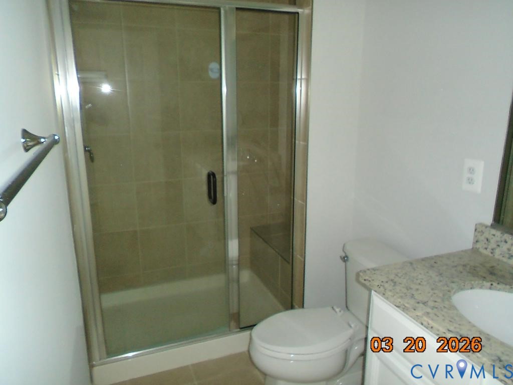 645 Rivanna Hill Road Glen Allen, VA 23060 - Photo 15 of 25 Bathroom featuring vanity and a stall shower