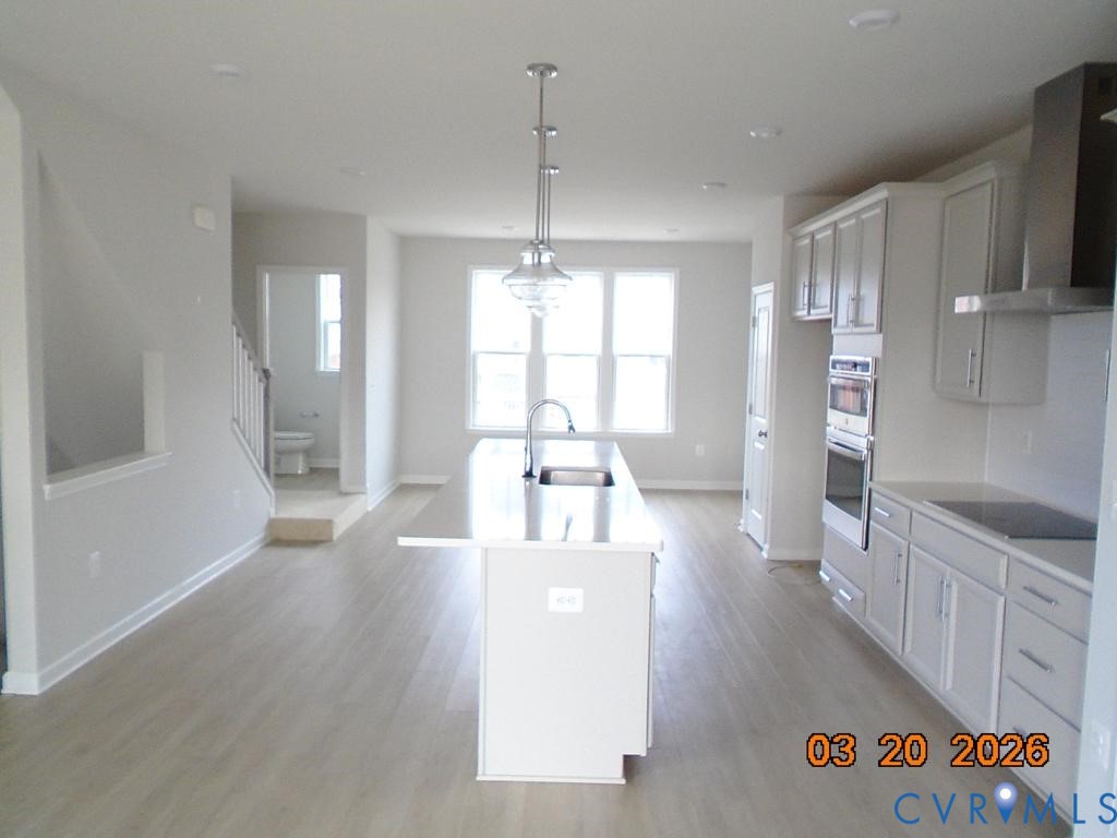 645 Rivanna Hill Road Glen Allen, VA 23060 - Photo 2 of 25 Kitchen with white cabinetry, a kitchen island wit