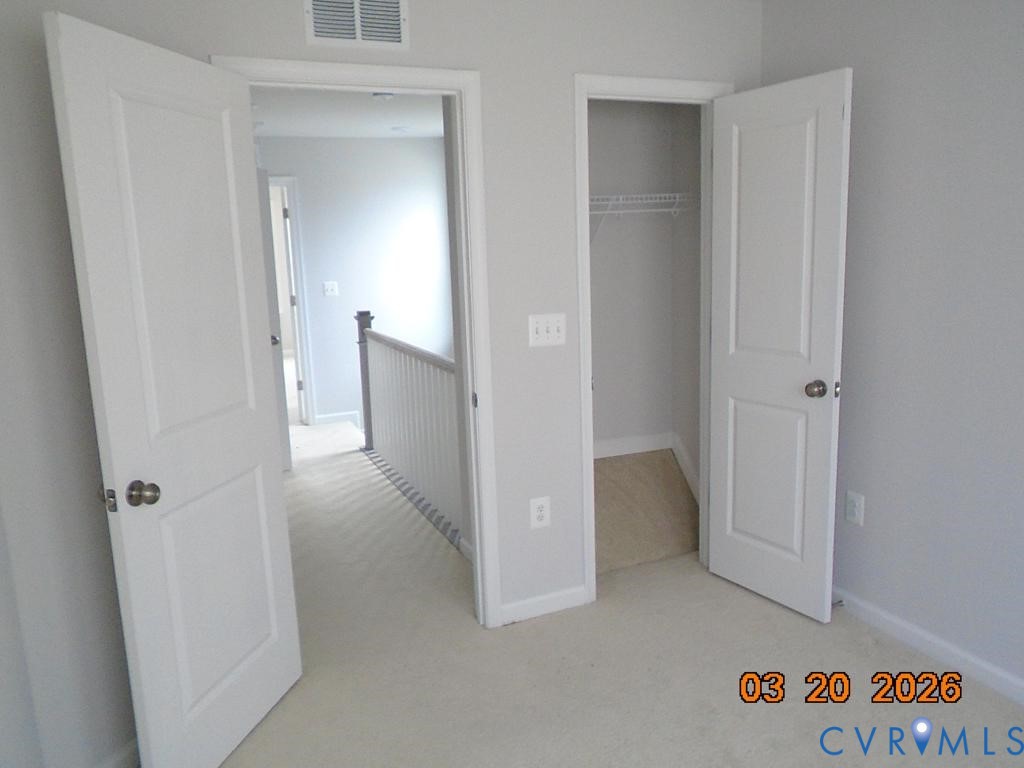 645 Rivanna Hill Road Glen Allen, VA 23060 - Photo 22 of 25 Unfurnished bedroom with light carpet and a closet