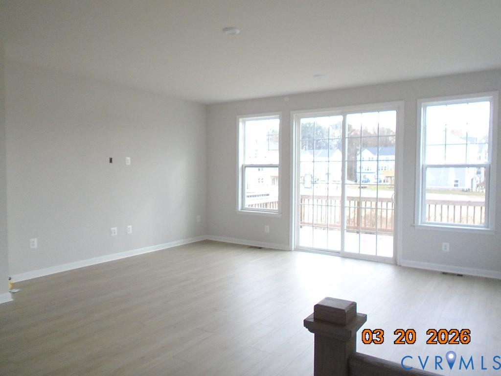 645 Rivanna Hill Road Glen Allen, VA 23060 - Photo 10 of 25 Unfurnished living room with light wood-style floo