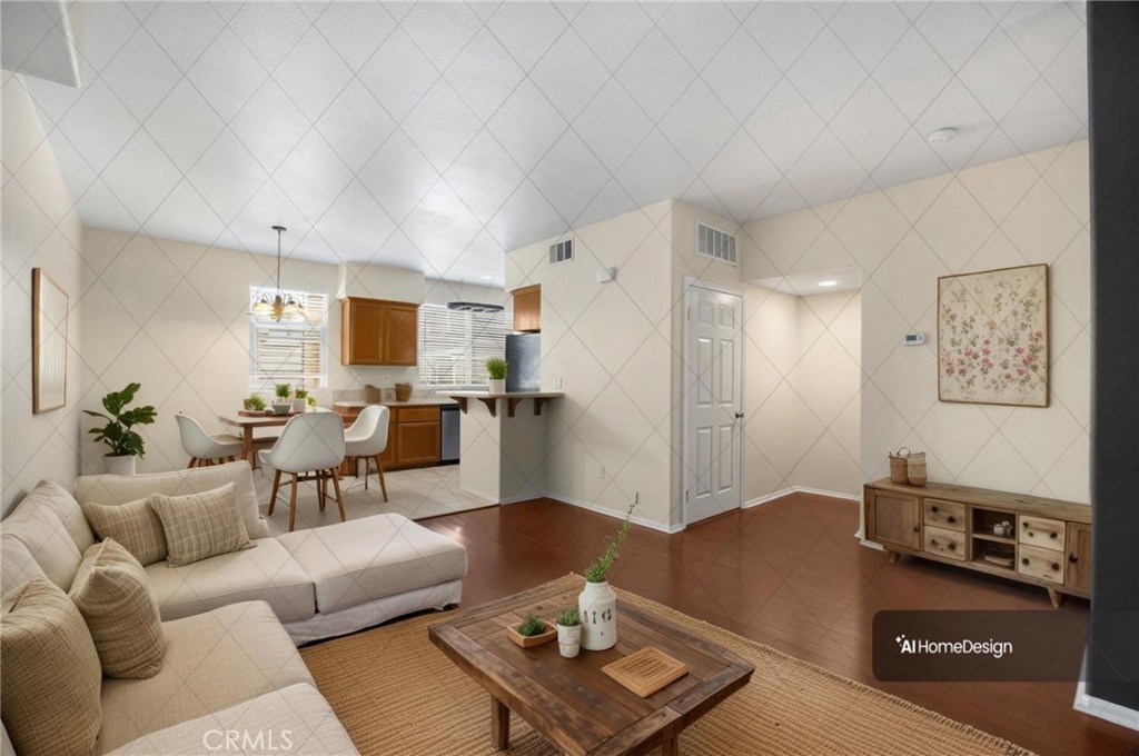 a living room with furniture and wooden floor