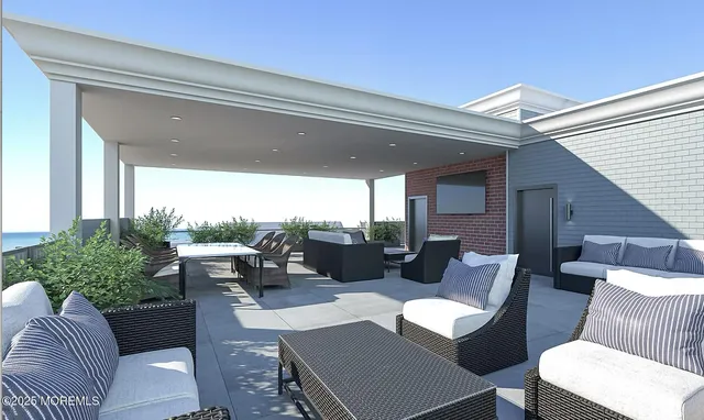 a outdoor living space with furniture and a potted plant