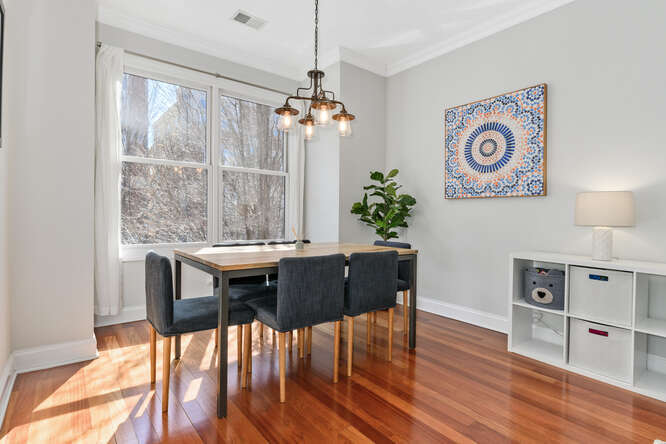 2118 West Rice Street, Unit 2 Chicago, IL 60622 - Photo 11 of 22 a view of a dining room with furniture window and wooden floor