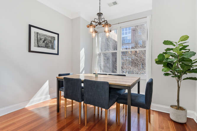 2118 West Rice Street, Unit 2 Chicago, IL 60622 - Photo 12 of 22 a view of a dining room with furniture window and wooden floor