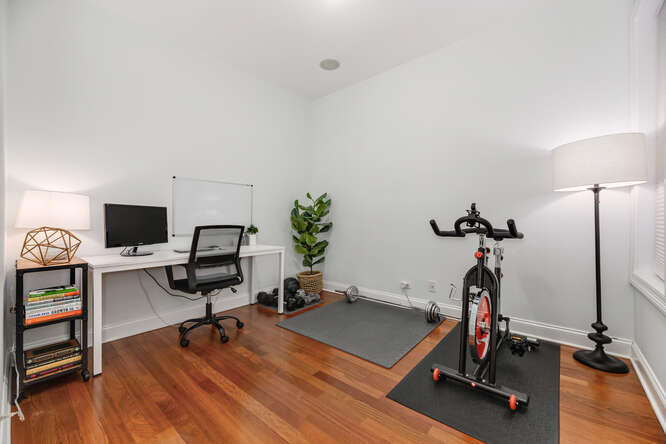 2118 West Rice Street, Unit 2 Chicago, IL 60622 - Photo 19 of 22 a view of a workspace with furniture and a gym cycle