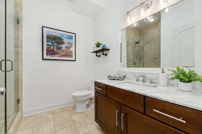 2118 West Rice Street, Unit 2 Chicago, IL 60622 - Photo 20 of 22 a bathroom with a toilet a sink and mirror