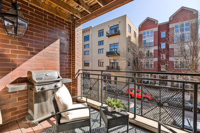 2118 West Rice Street, Unit 2 Chicago, IL 60622 - Photo 21 of 22 a view of a balcony with wooden floor and outdoor seating
