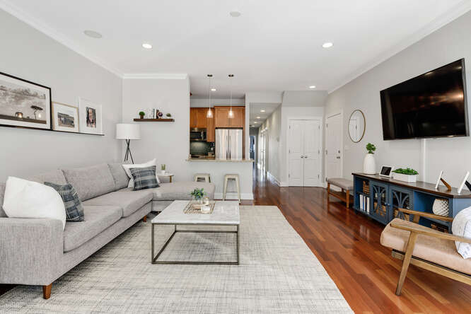 2118 West Rice Street, Unit 2 Chicago, IL 60622 - Photo 4 of 22 a living room with furniture and a flat screen tv