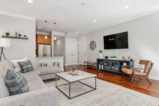 2118 West Rice Street, Unit 2 Chicago, IL 60622 - Photo 10 of 22 a living room with furniture and a flat screen tv