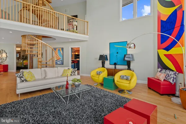 a kitchen with stainless steel appliances kitchen island granite countertop a table and chairs